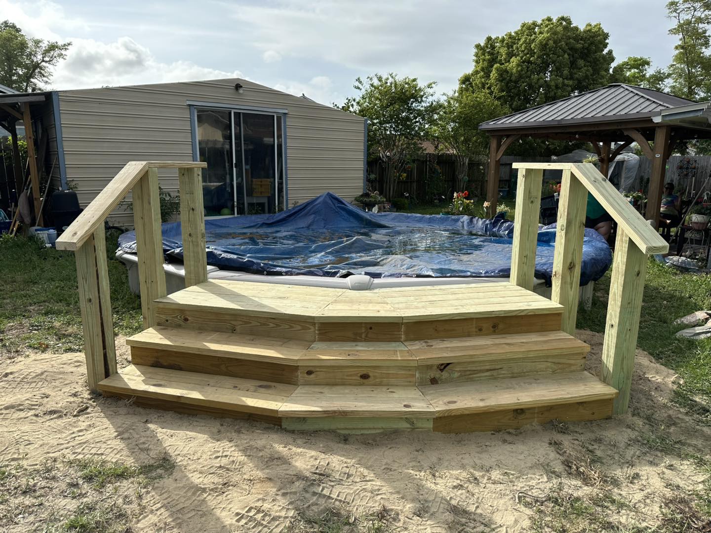 Custom-built pool stairs and a new deck
